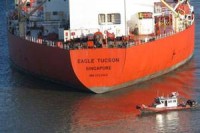 A 33-ft response boat from U.S. Coast Guard Station Venice, La., monitors efforts to free the grounded tank vessel Eagle Tucson, Monday, Sept. 28, 2009, near Pilottown, La., at the mouth of the Mississippi. The Eagle Tucson grounded at approximately 2:45 a.m., Monday, Sept. 28, 2009, and is currently blocking deep-draft shipping traffic.