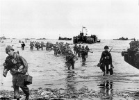 american assaults troops wading ashore on omaha beach.jpg