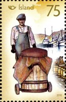 2010 Man-rolling-herring-barrel.jpg